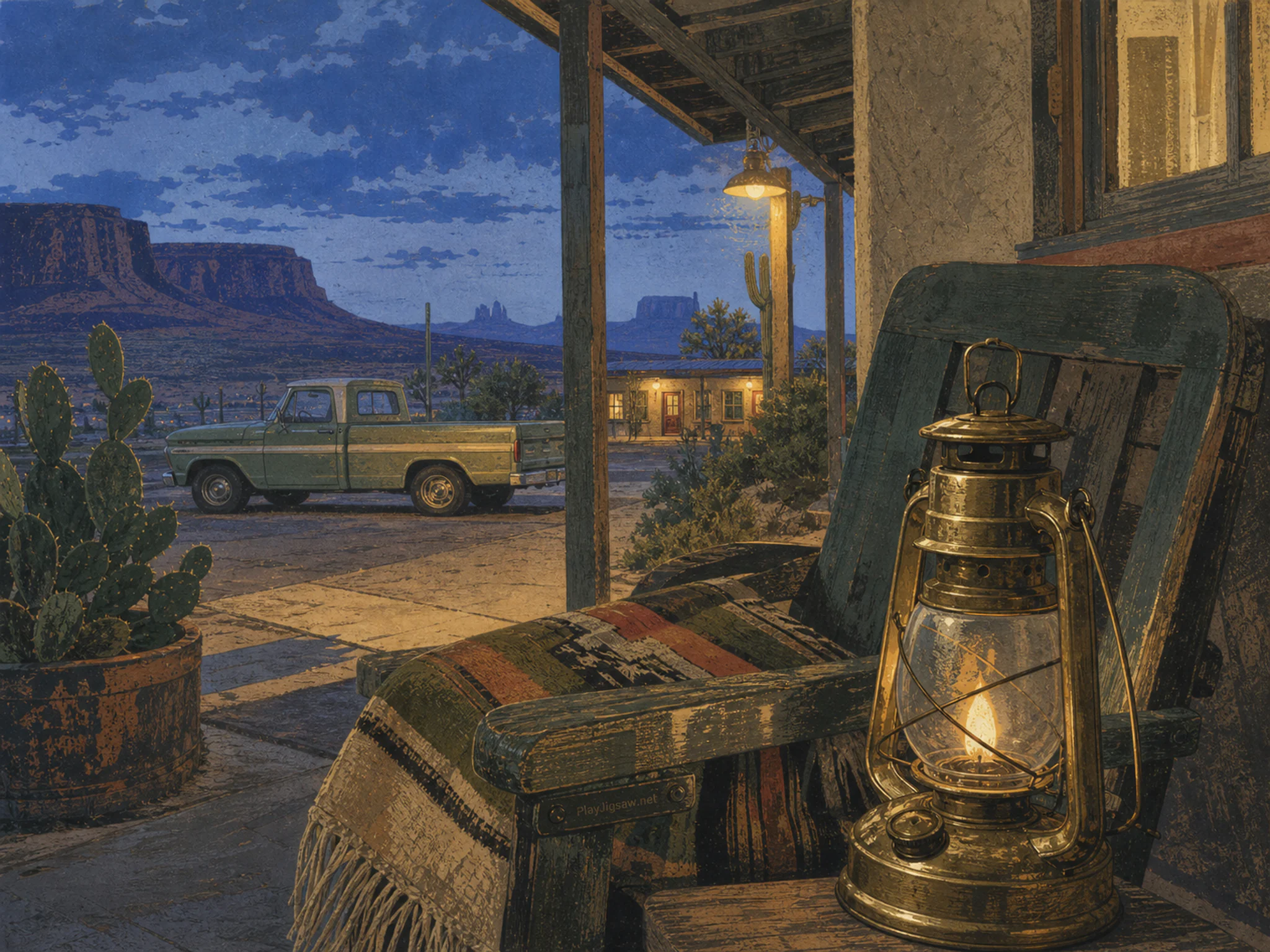 desert motel terrace resting naturally beside a brass storm lantern in an evening roadside motel terrace with a lamp and folded blanket, with familiar objects and cool blue-hour.