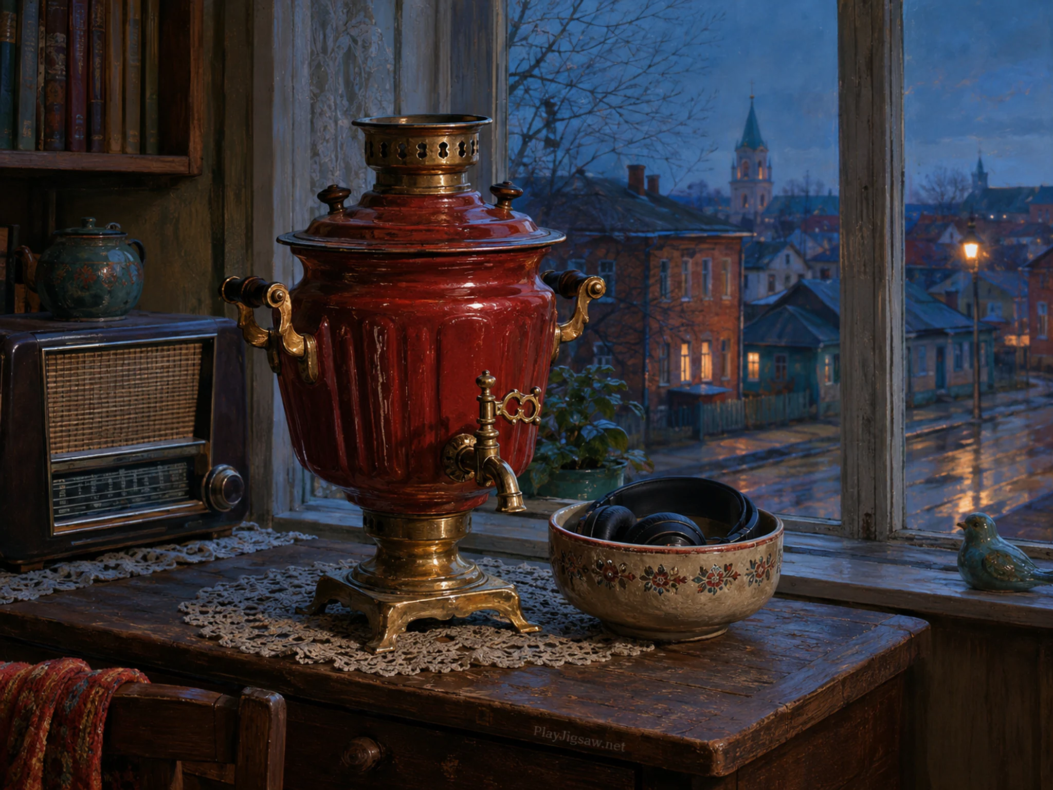 carmine samovar resting naturally beside a ceramic headphone bowl in a living-room radio desk beside a street-facing window, with familiar objects and cool blue-hour light.